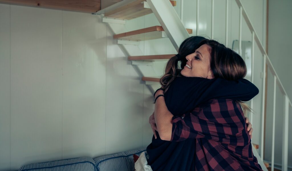 Happy woman hugging her friend